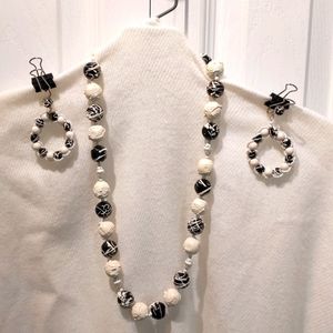 Vintage black and white beaded necklace set with matching clip-on earrings.